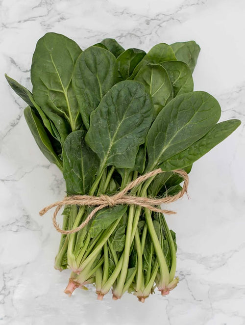 Fresh spinach rich in magnesium and minerals for women's hormonal health